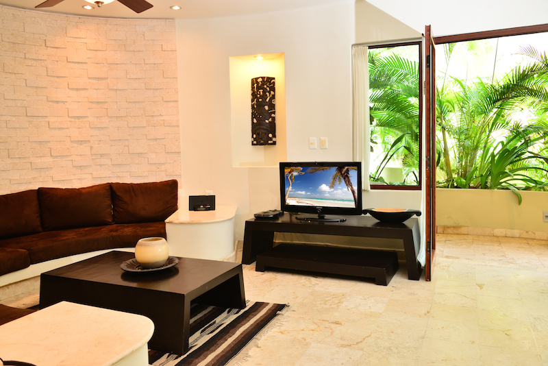 Exterior of Maya Villa building with lush landscaping